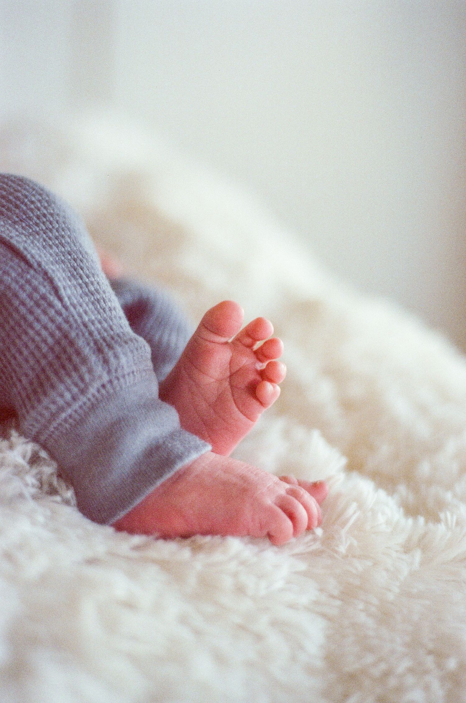 Newborn photography session captured on 35mm film by Klean Vision Photo, a Norfolk and Virginia Beach photographer