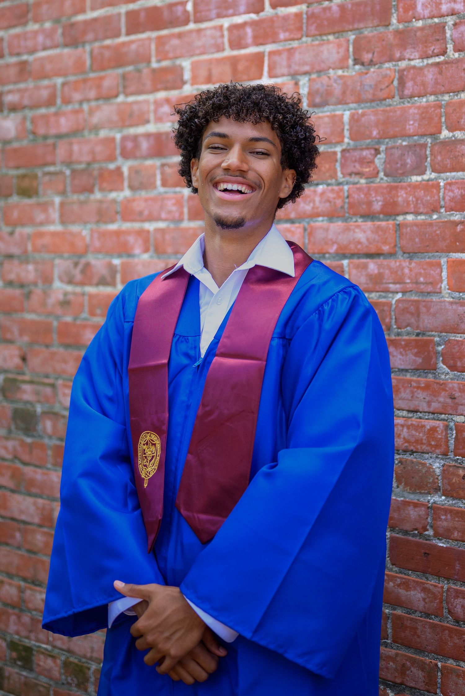 Outdoor graduate session with Norfolk urban in background by Norfolk photographer