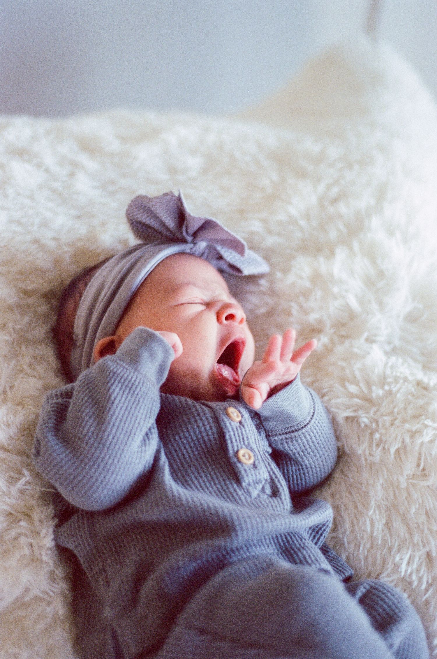 Newborn photography session captured on 35mm film by Klean Vision Photo, a Norfolk and Virginia Beach photographer