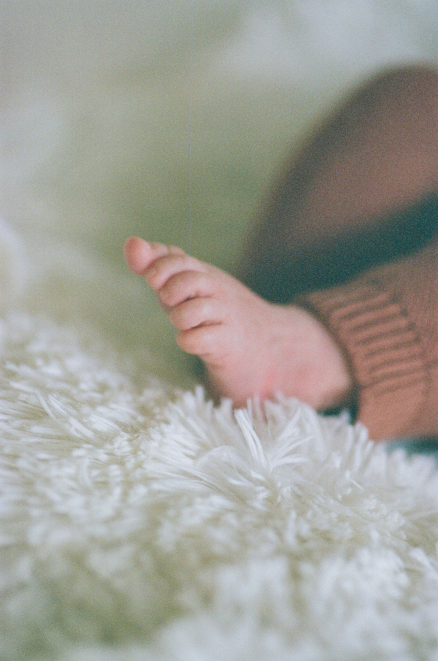 Newborn photography session captured on 35mm film by Klean Vision Photo, a Norfolk and Virginia Beach photographer