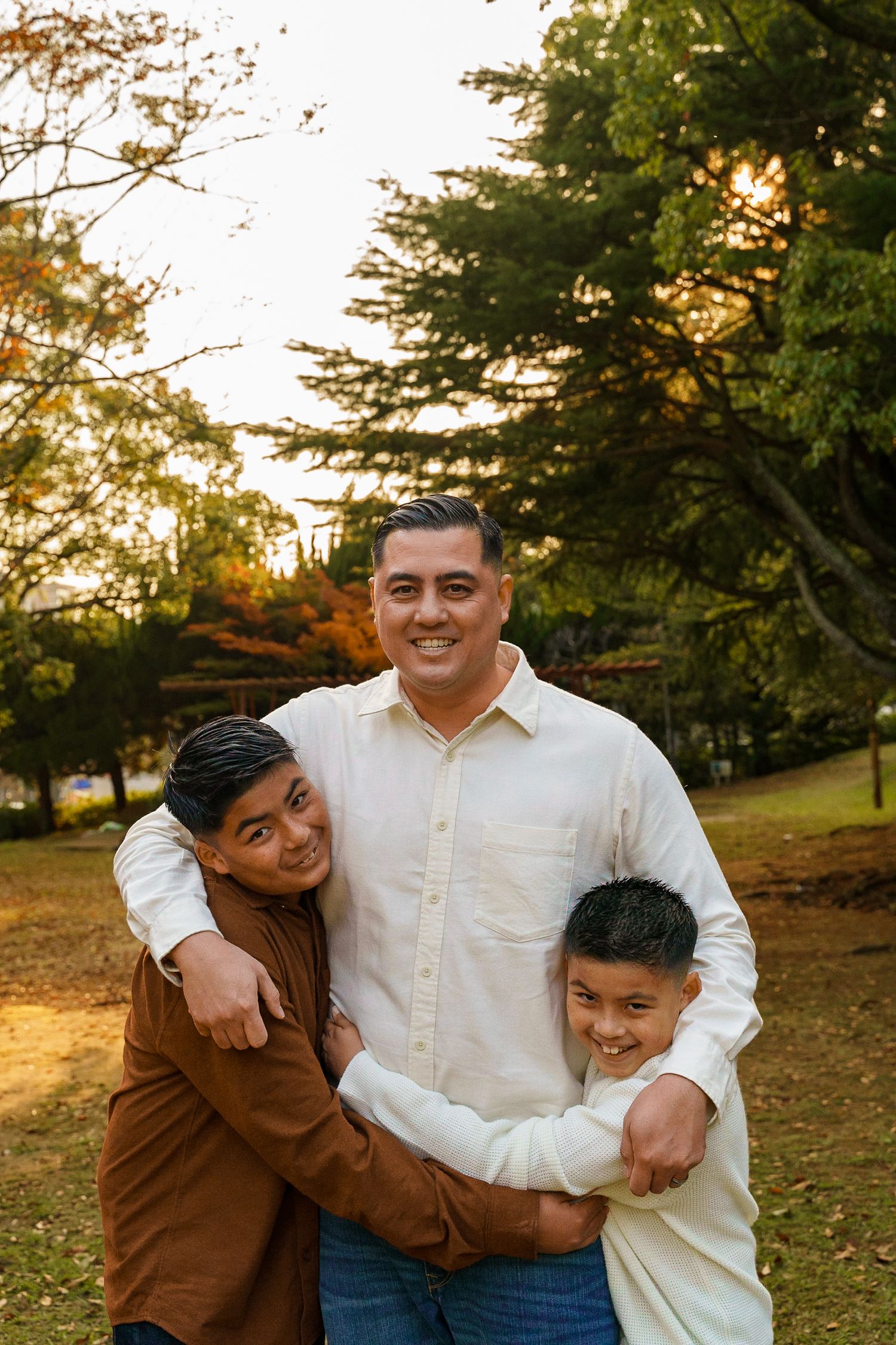 Family photo of Norfolk at park during golden hour