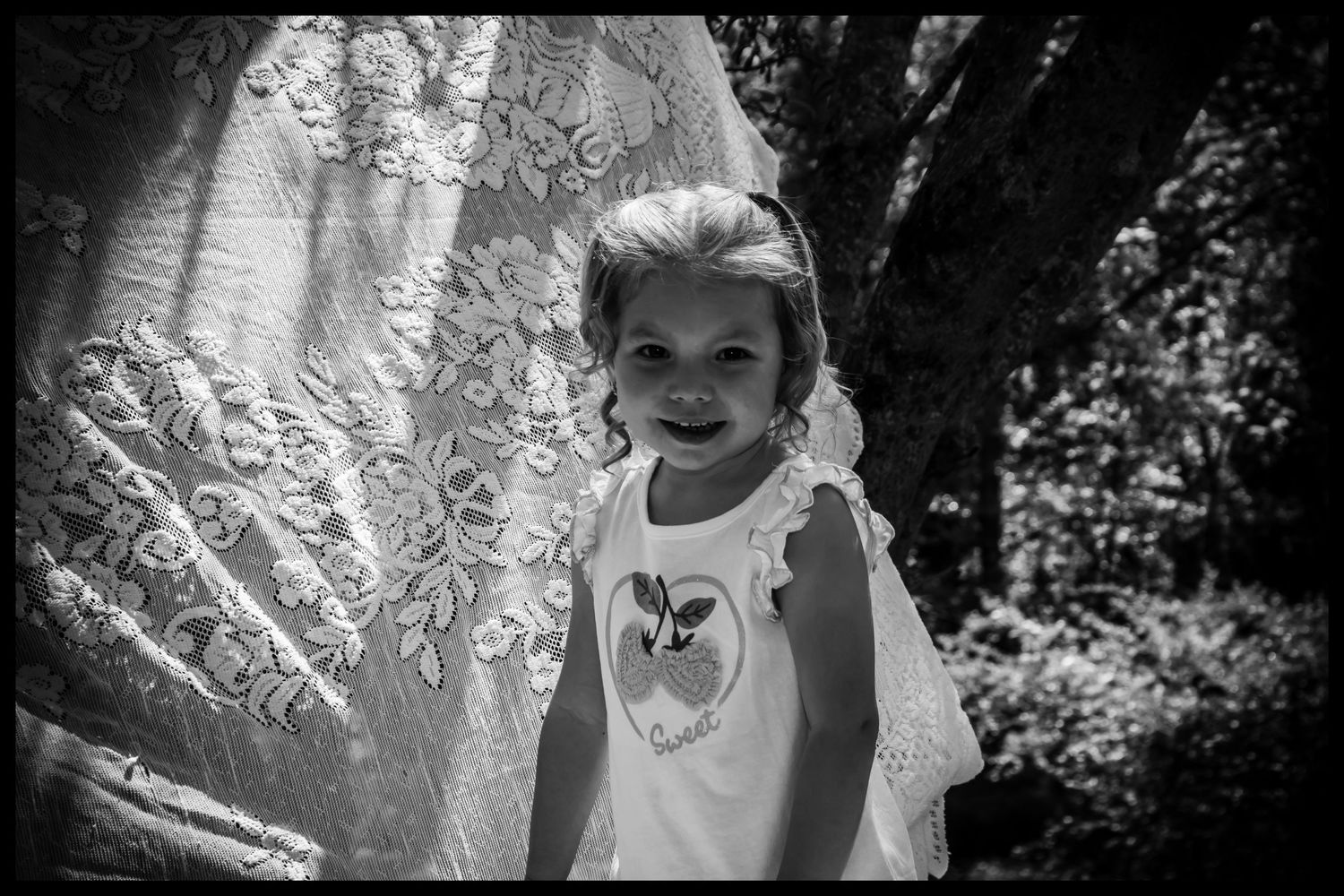 black and white photo of a 2 year old girl