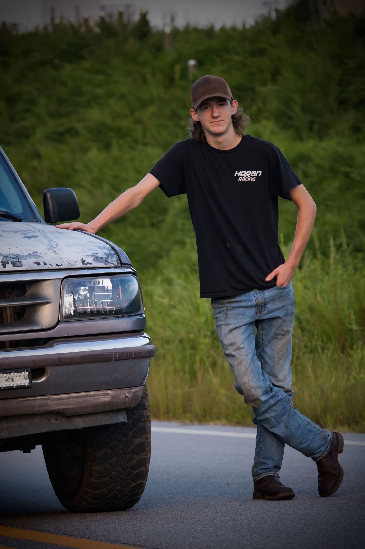Outdoor family photography featuring boy and classic truck in Bethlehem GA