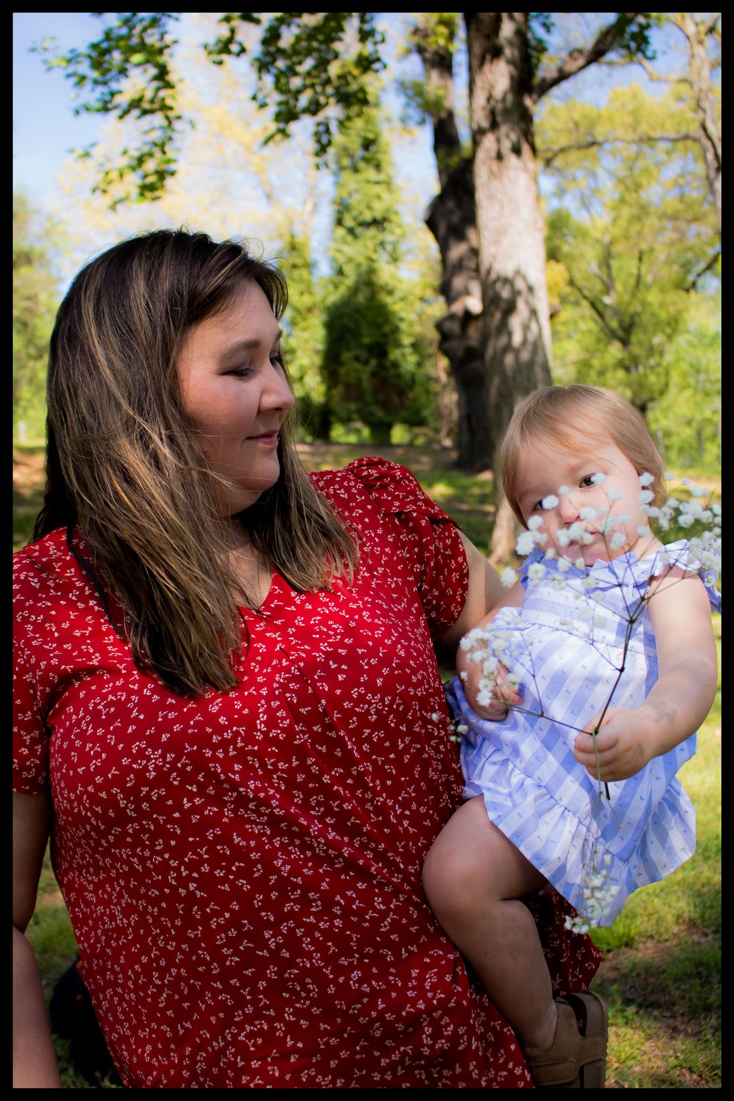 mom holding her daughter