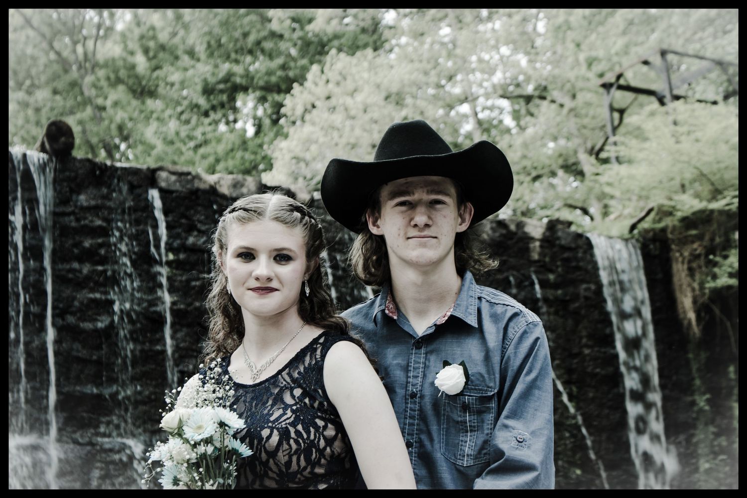 couple in front of waterfall