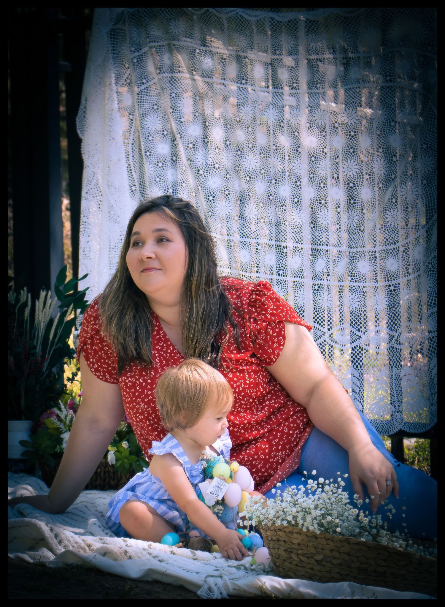 mom sitting with her baby girl