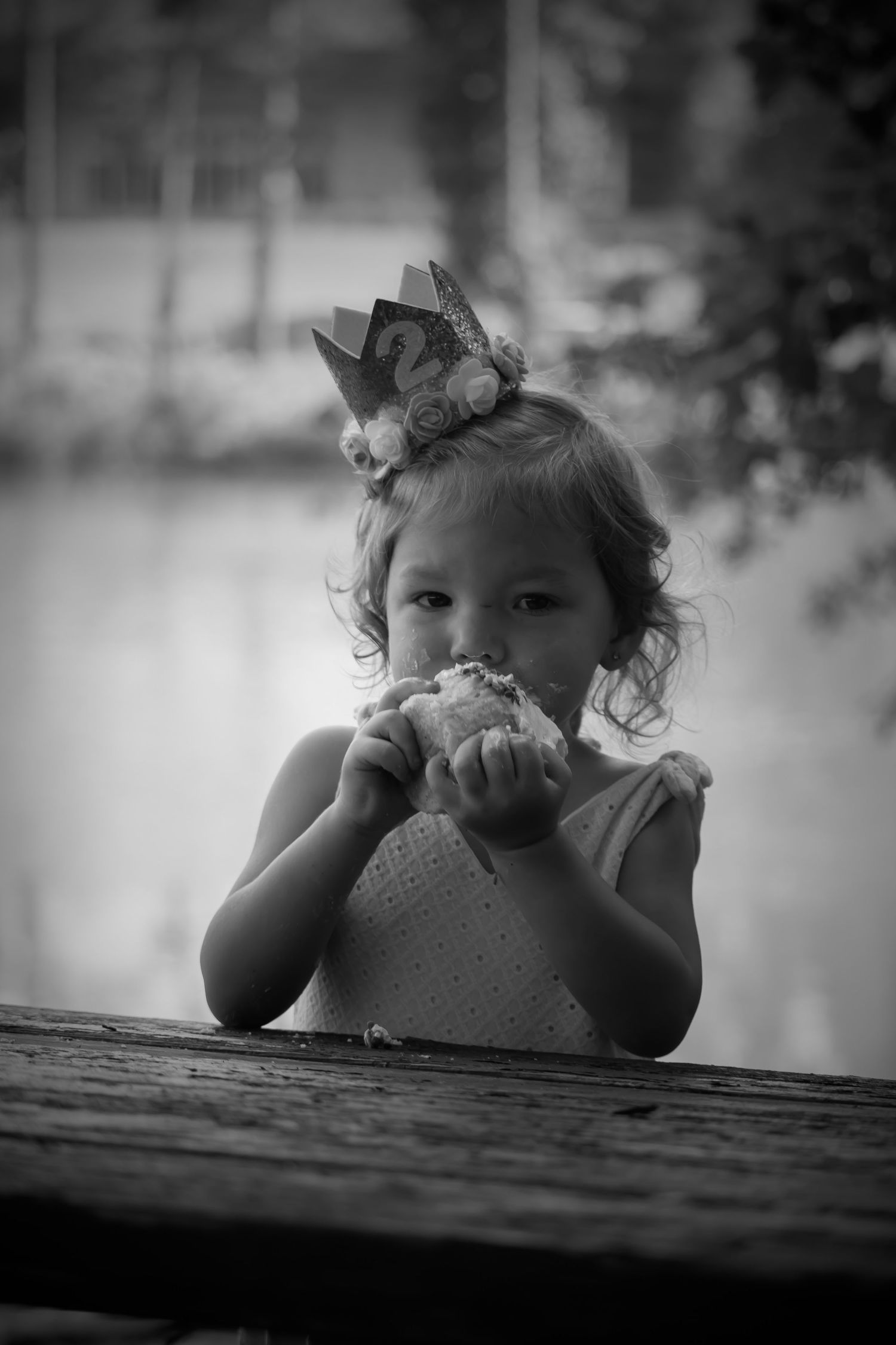 birthday girl eating a cupcake black and white photo