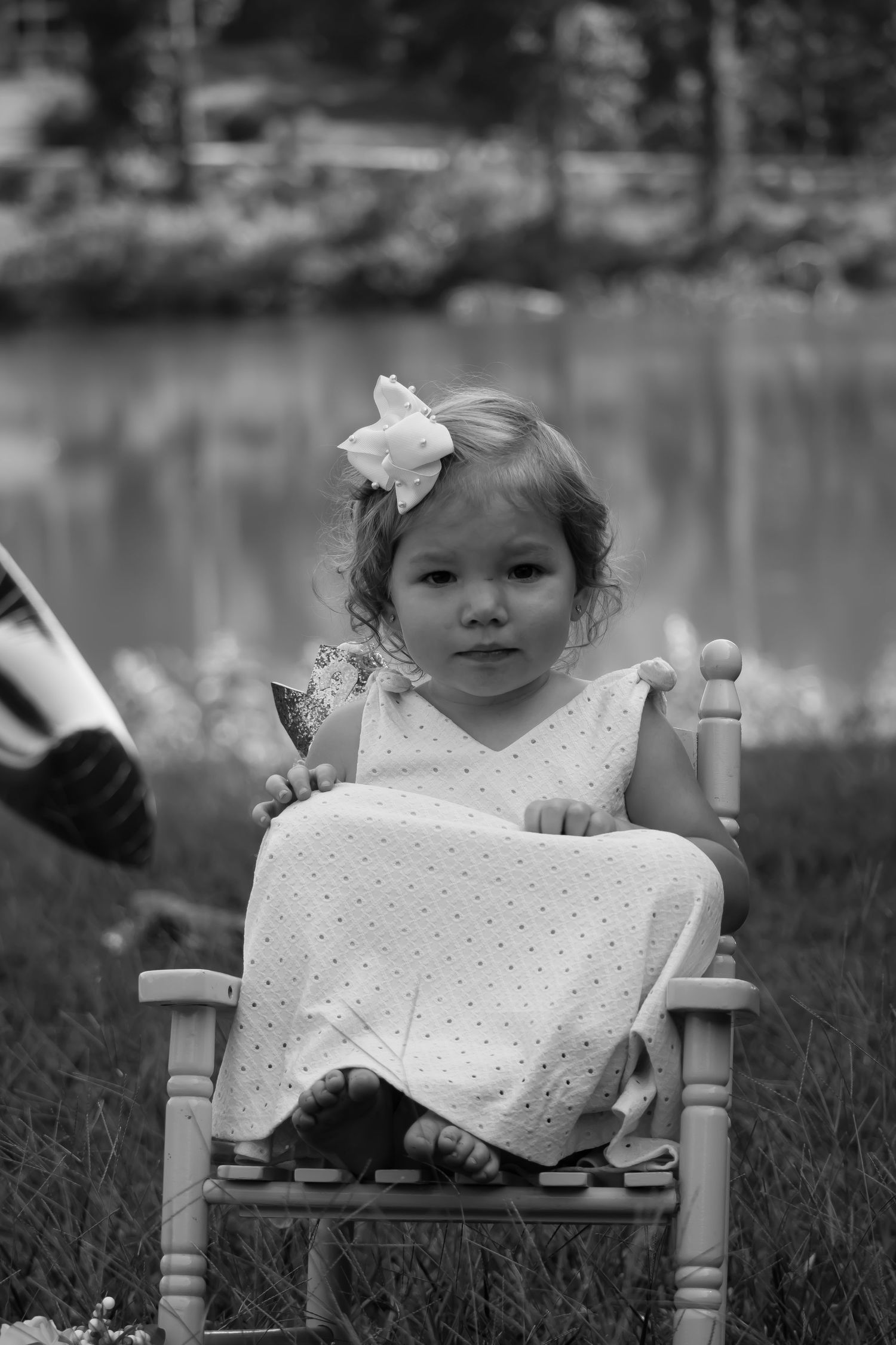 black and white photo of 2yr old sitting in chair