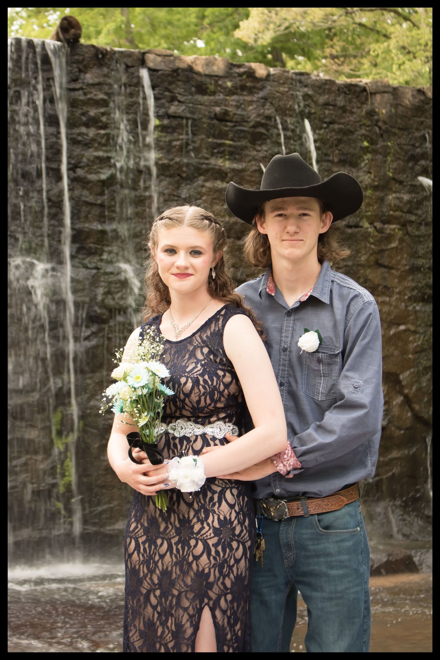 couple in front of waterfall