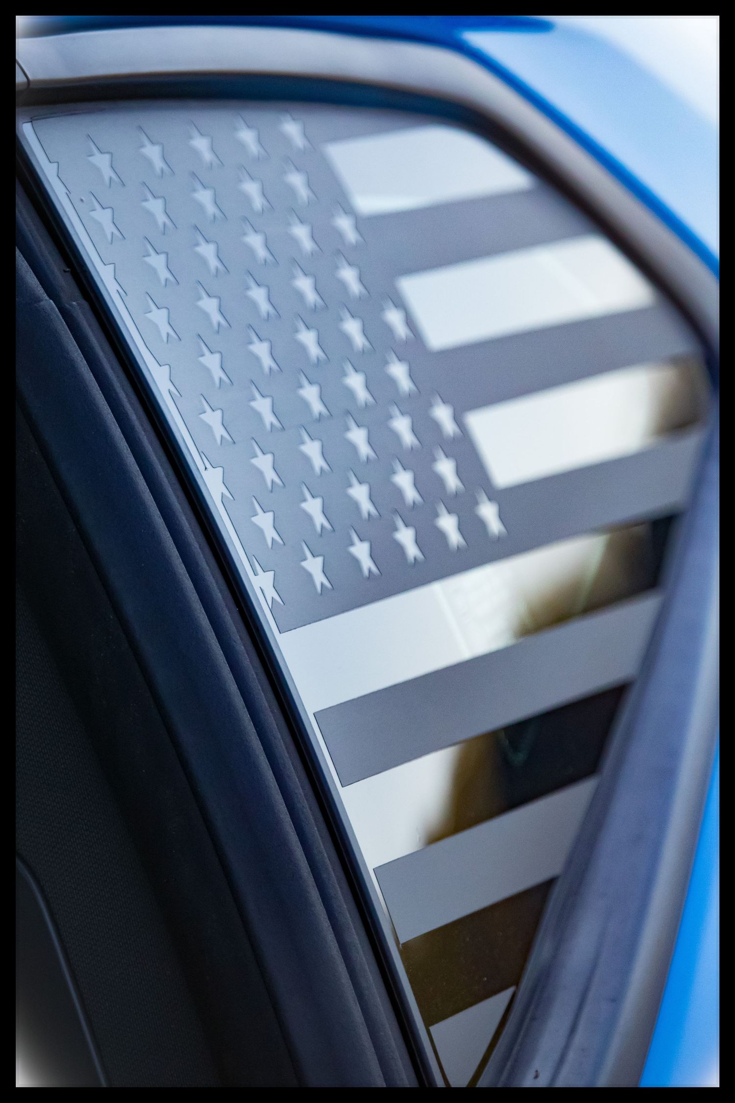 American Flag decal on side window