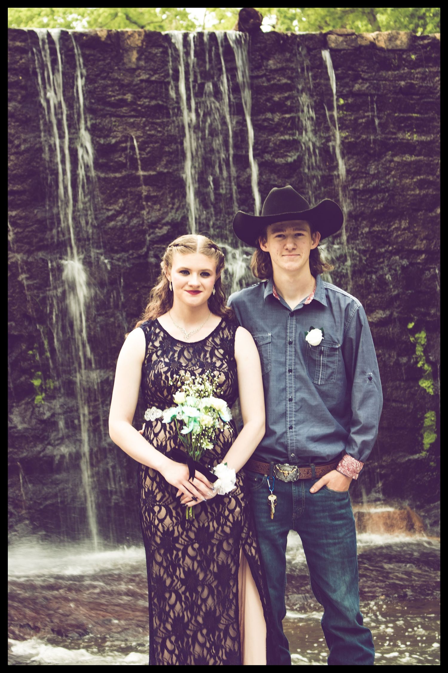 couple in front of waterfall