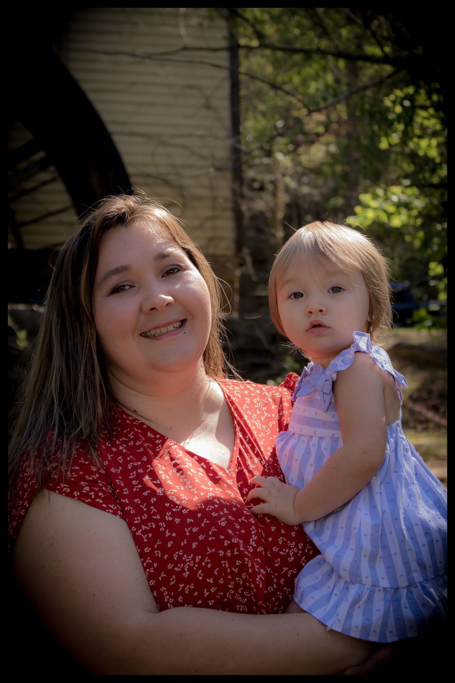 mom holding her daughter
