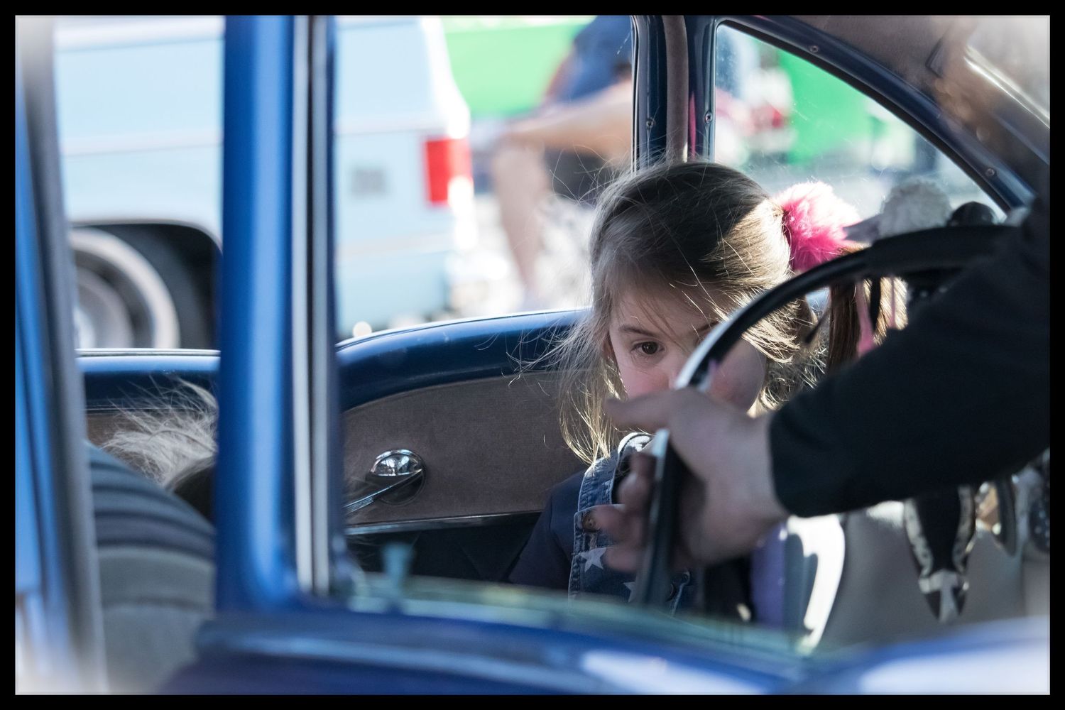 Child in back seat of car