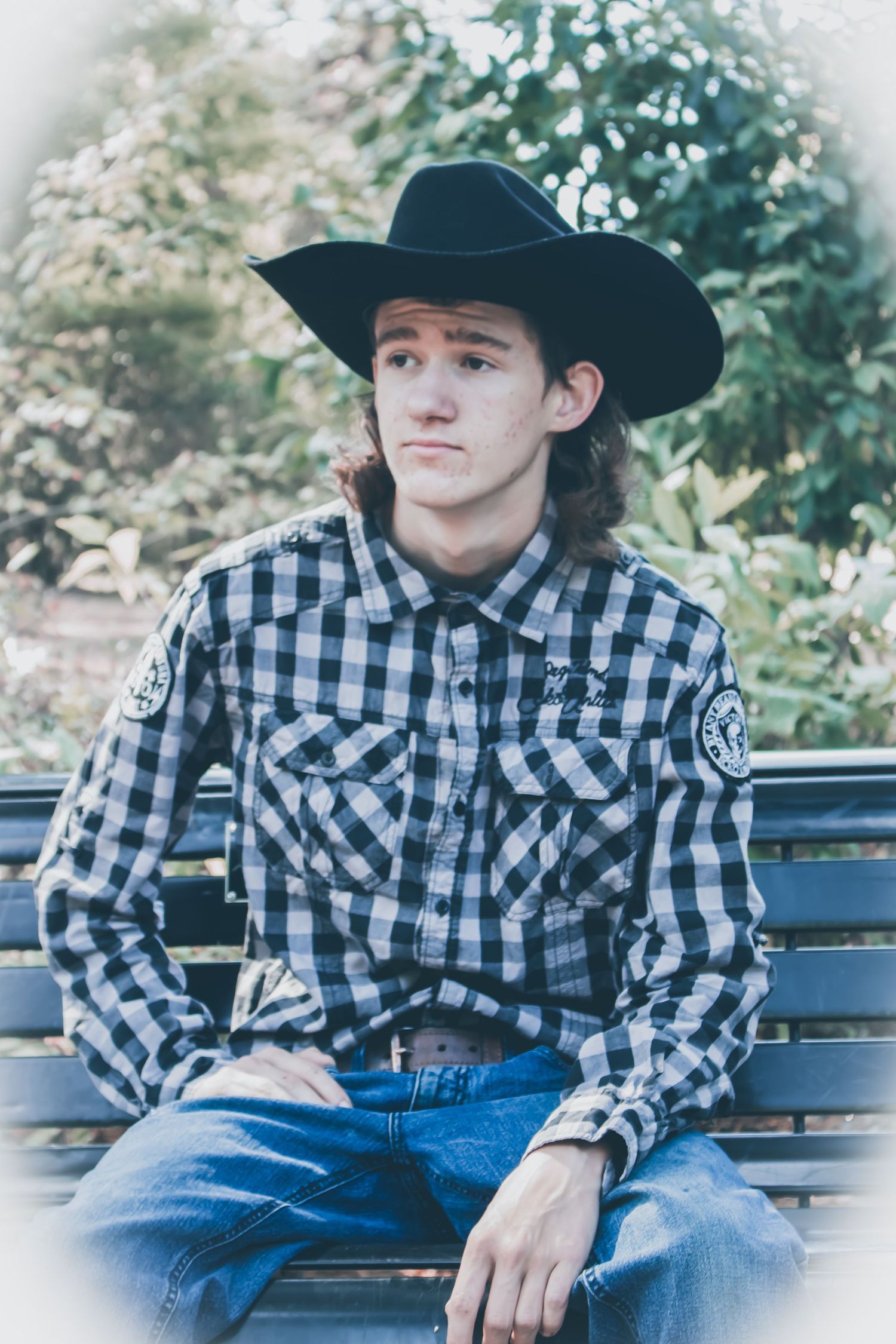 young adult wearing a cowboy hat