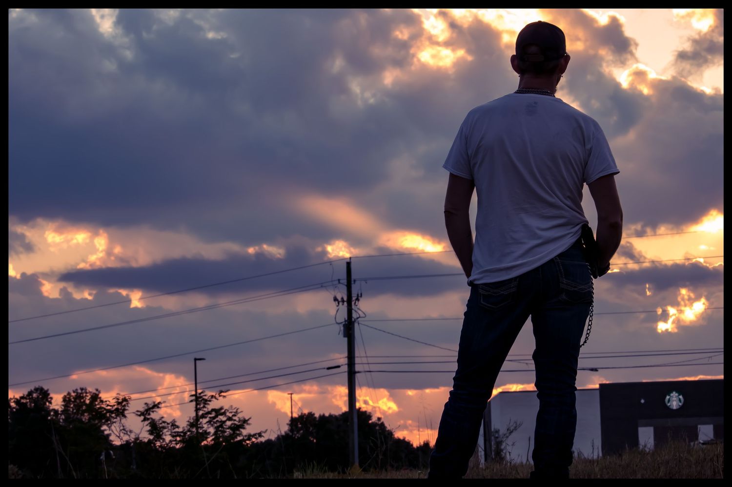 man with sunset in background