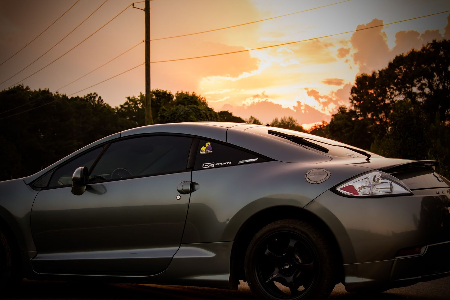 car with sunset in background