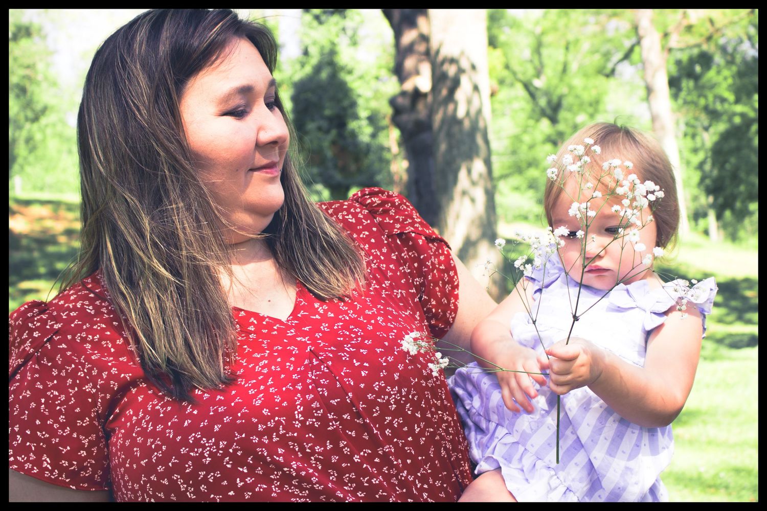 mom holding her daughter