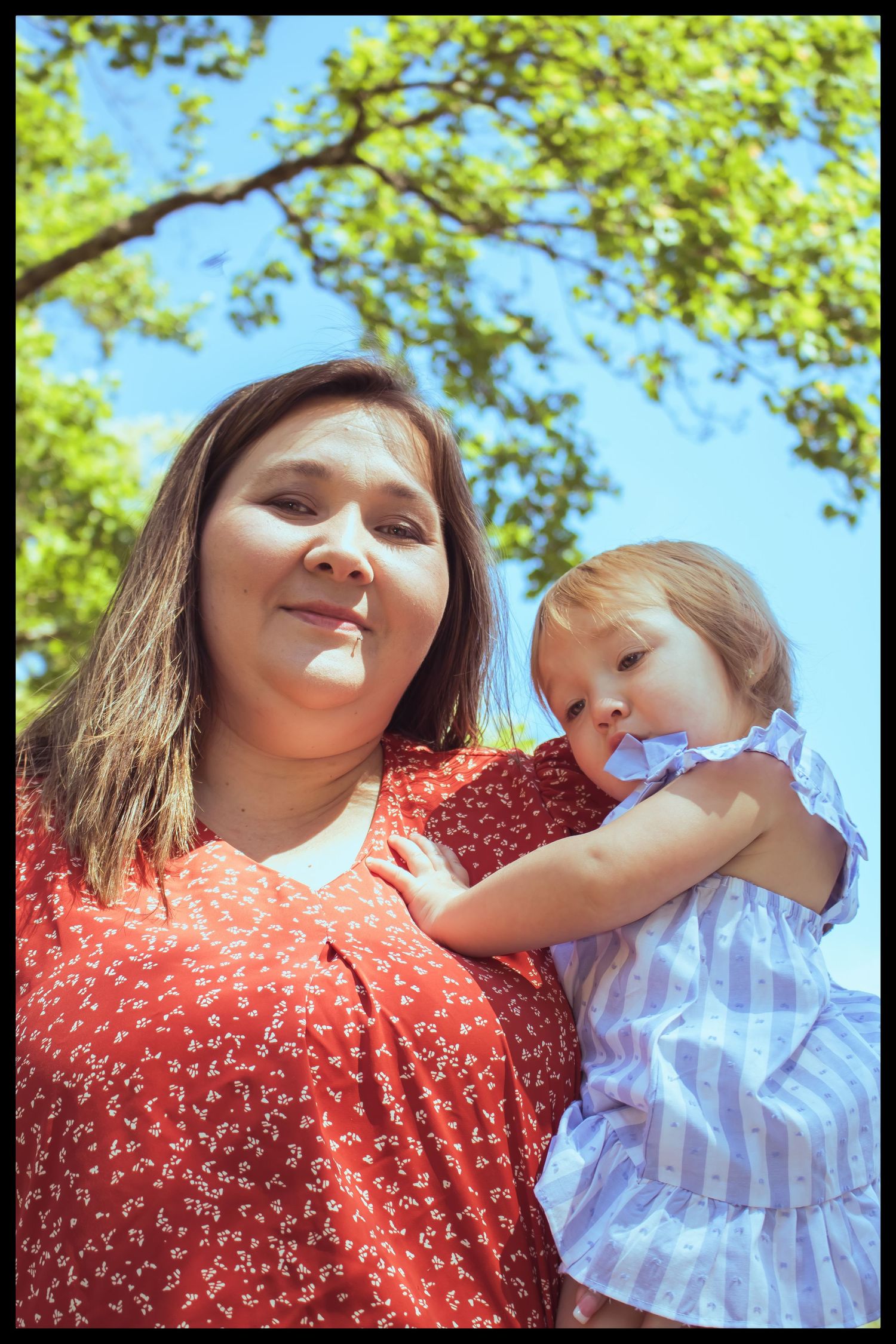 mom holding her daughter