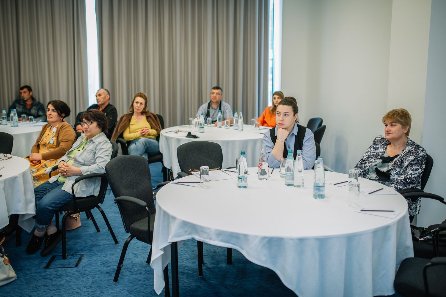 Roundtable panel discussion in progress with experts seated and engaged.