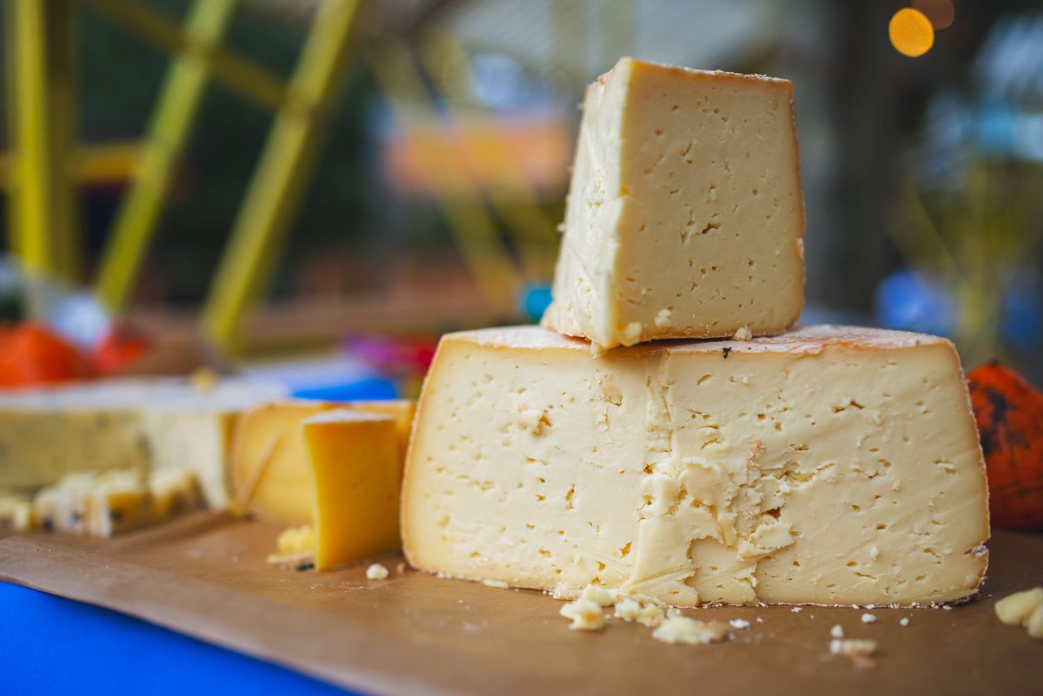 Close-up of a block of traditional Georgian cheese on display.