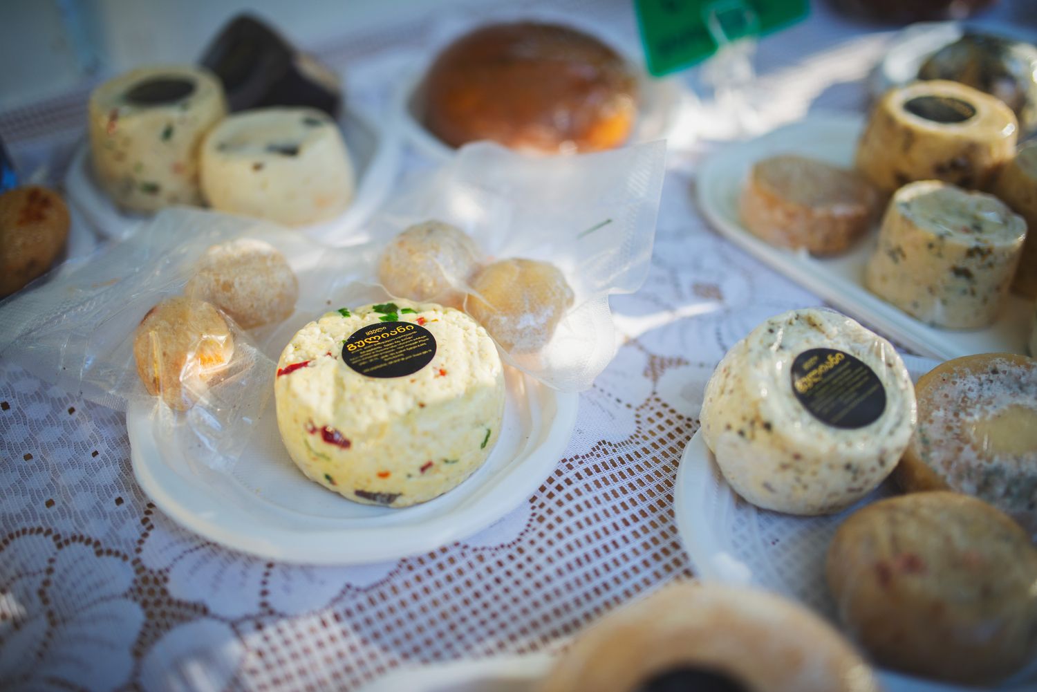 Close-up of traditional Georgian cheese served on a decorated table.