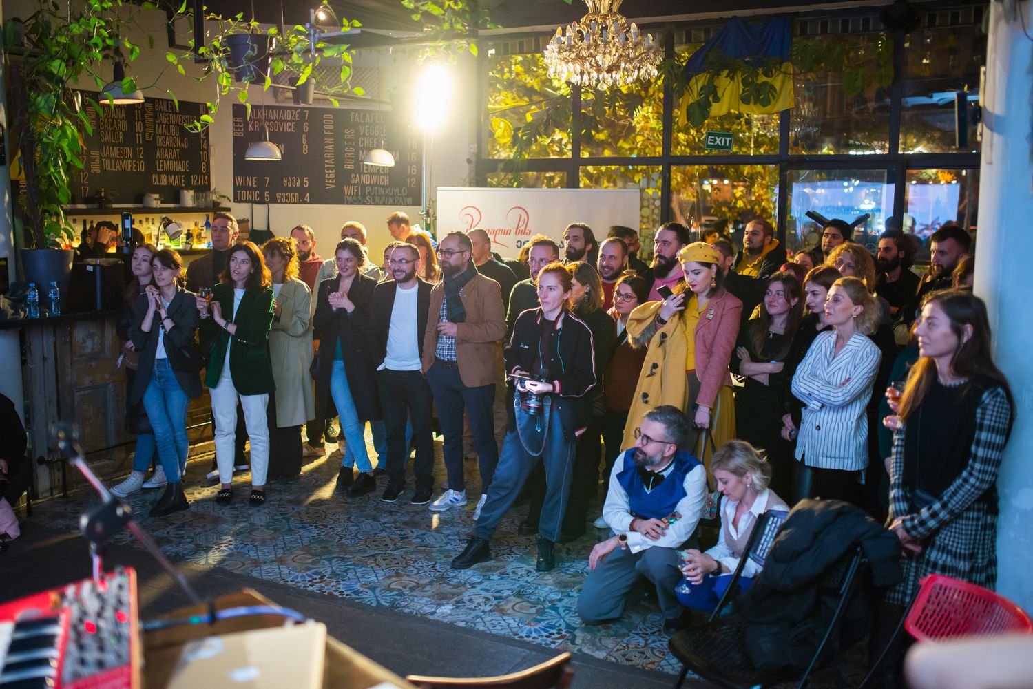 Live performance or music show taking place under green stage lighting during a festival.