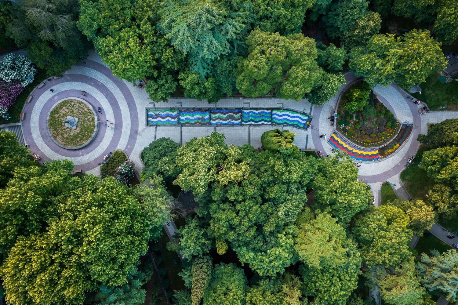 Symmetrical park layout with central structure, captured from above — geometric landscape design.