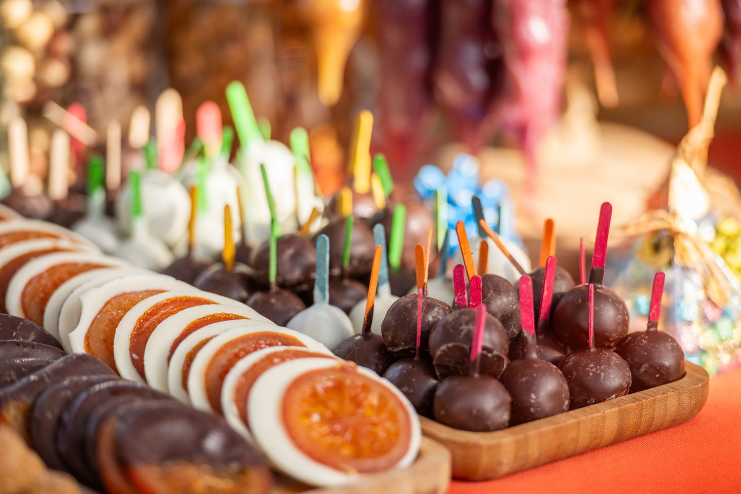 Colorful assortment of desserts and sweets at a vibrant food fair.