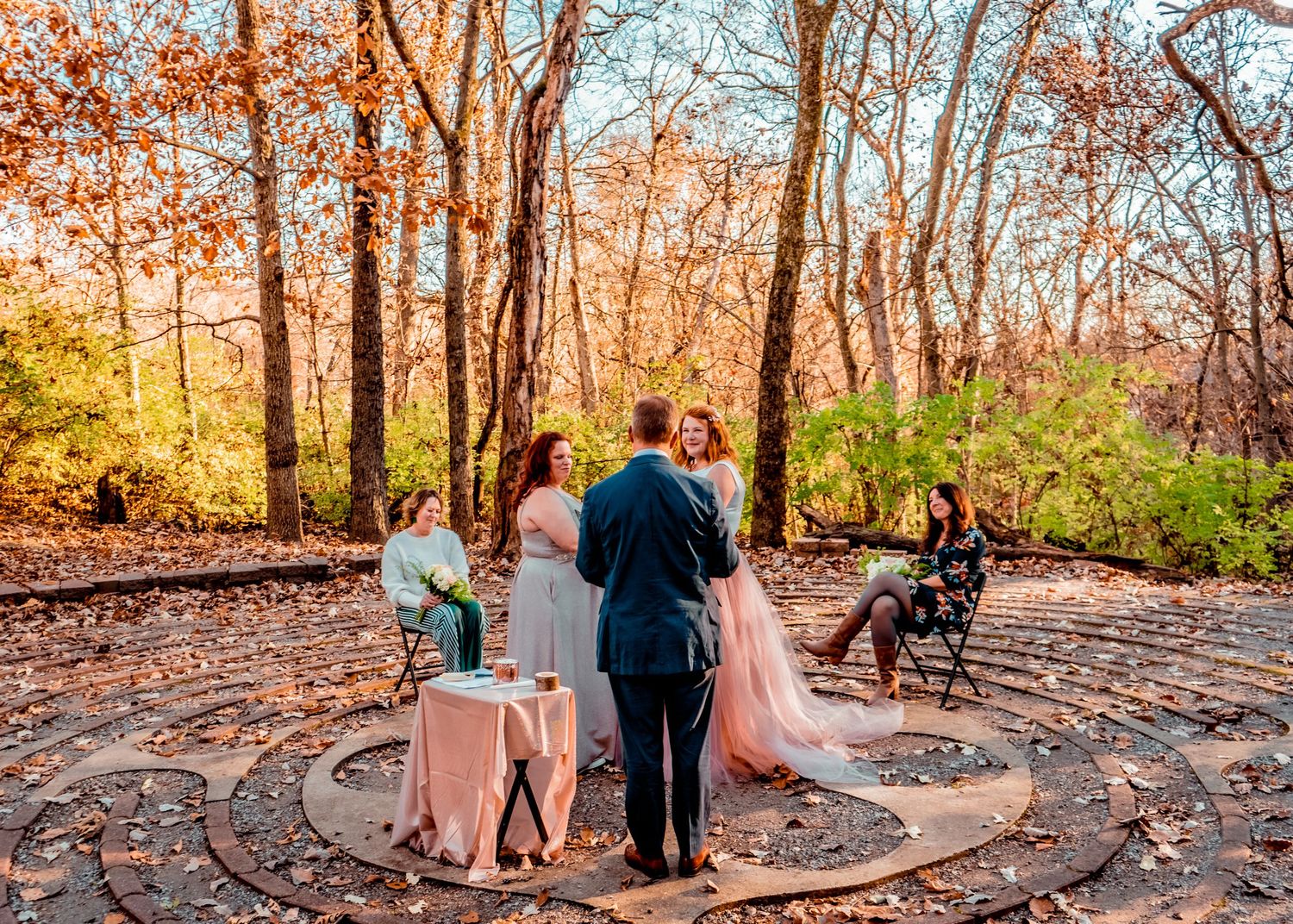 Wide-shot of the golden, intimate ceremony, nestled in the woods of Heartland Presbytery.