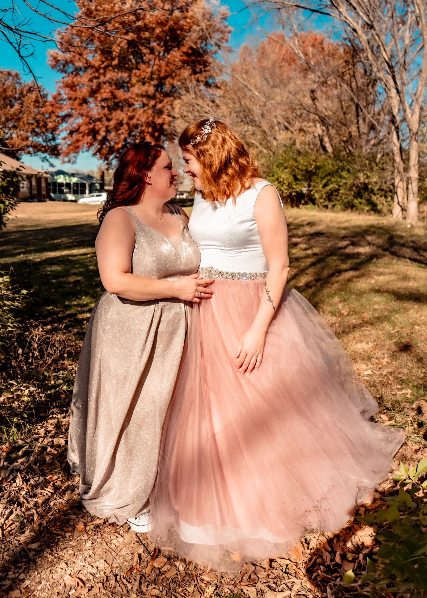 Captivated by each other; full frame shot, lovingly looking into each other's eyes along a forest trail.
