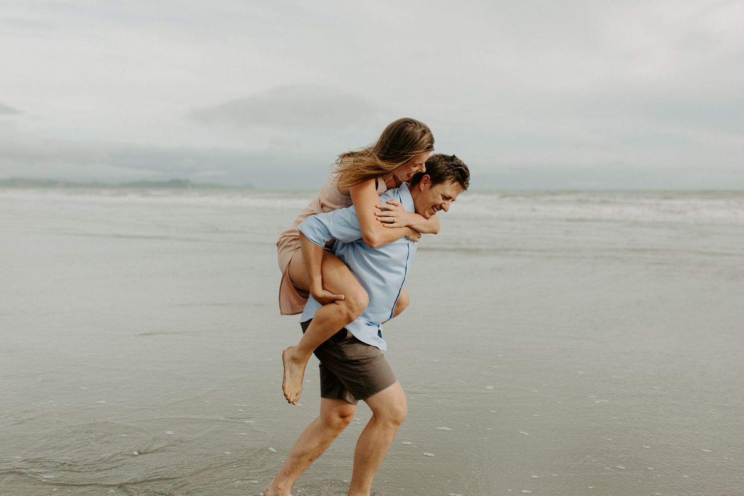 Couple on Nelson beach during lifestyle photoshoot