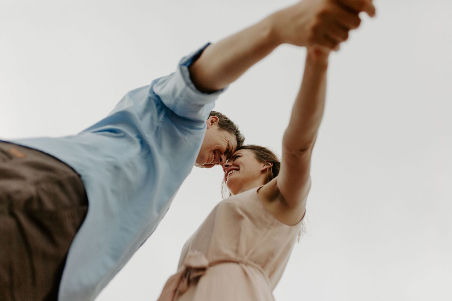 Couple hand in hand on Nelson beach during lifestyle photoshoot