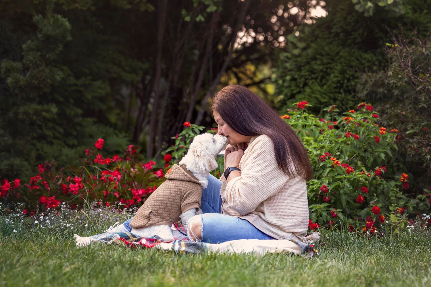 A woman kisses her dog on the nose at UT Gardens during pet photography session in Knoxville Tennessee
