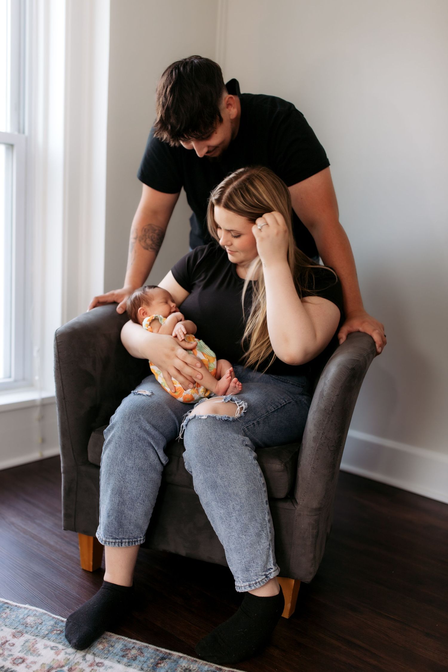 Studio Family session of parents and newborn, photographed by Jessica Rose Photography, Janesville Wisconsin.