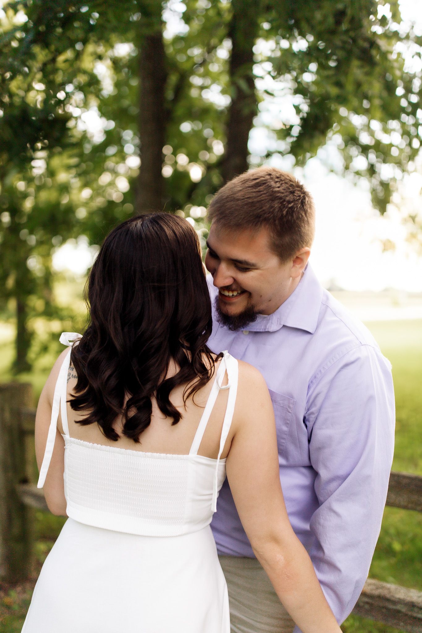 Engagement photography of a couple laughing and enjoying their session, photographed by Jessica Rose Photography, Janesville WI.