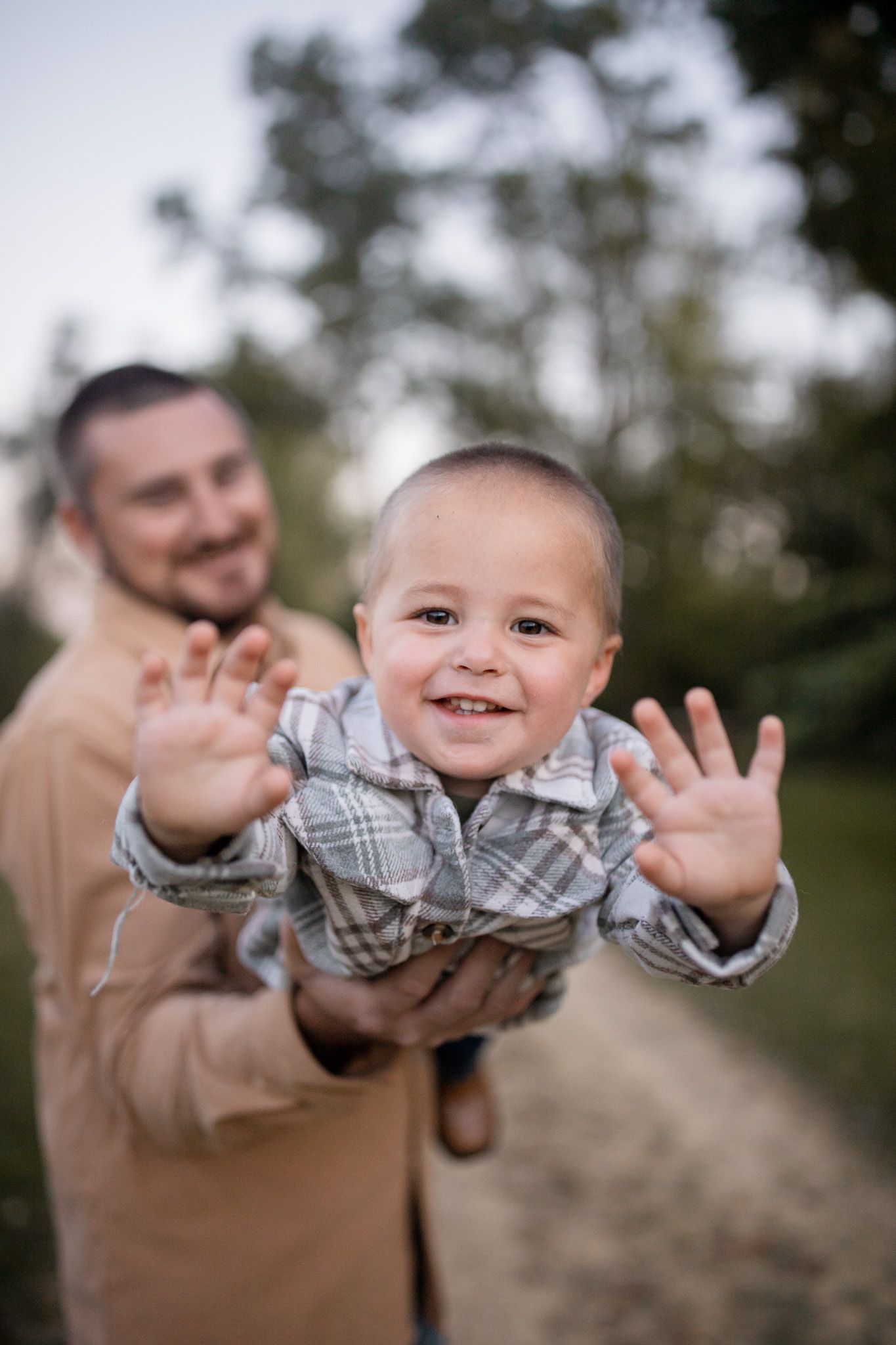 Outdoor family photography of father and young son playing together, photographed by Jessica Rose Photography, Janesville WI.