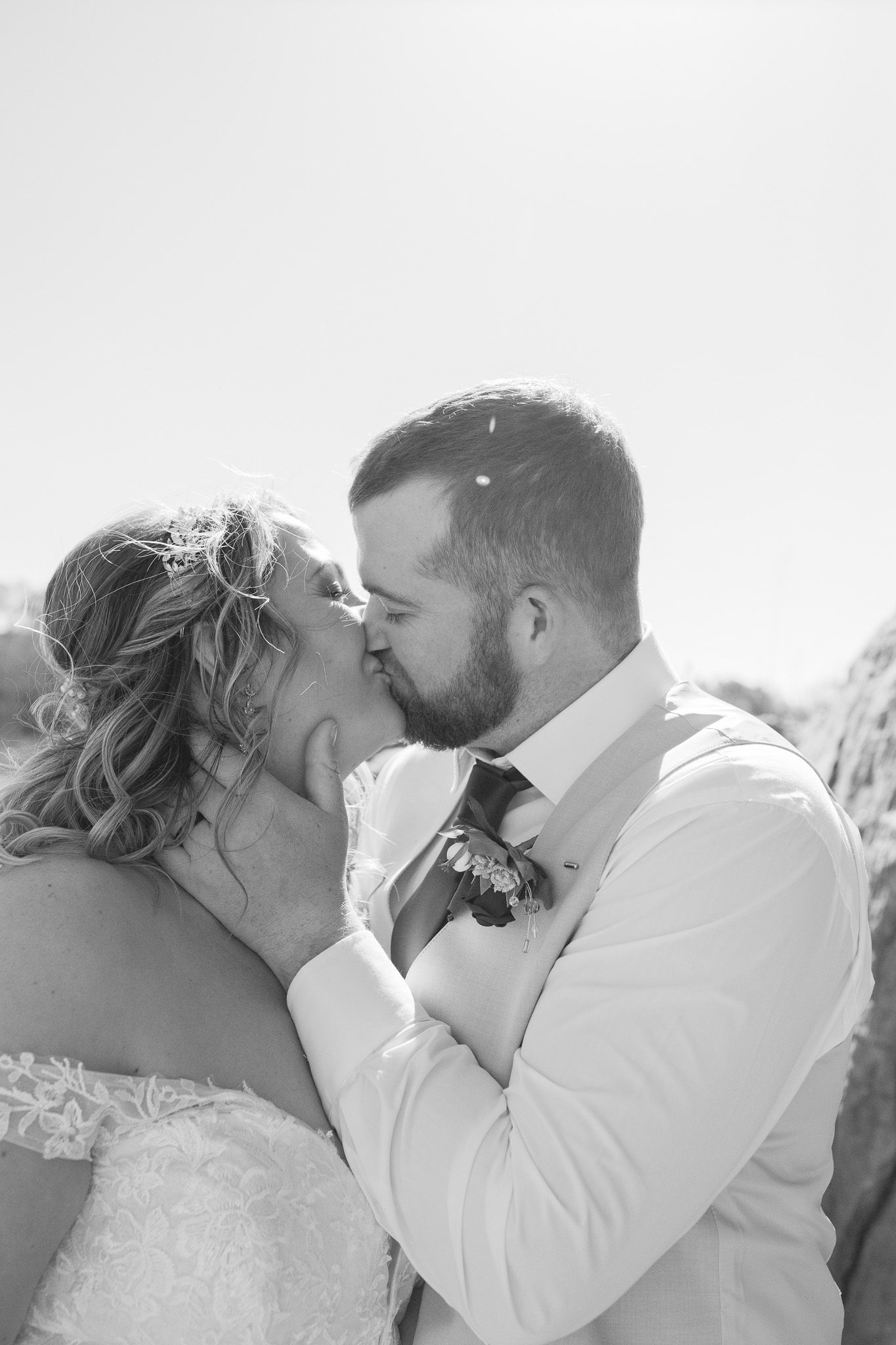 Outdoor wedding photography of bride and groom kissing, photographed by Jessica Rose Photography, Janesville WI.