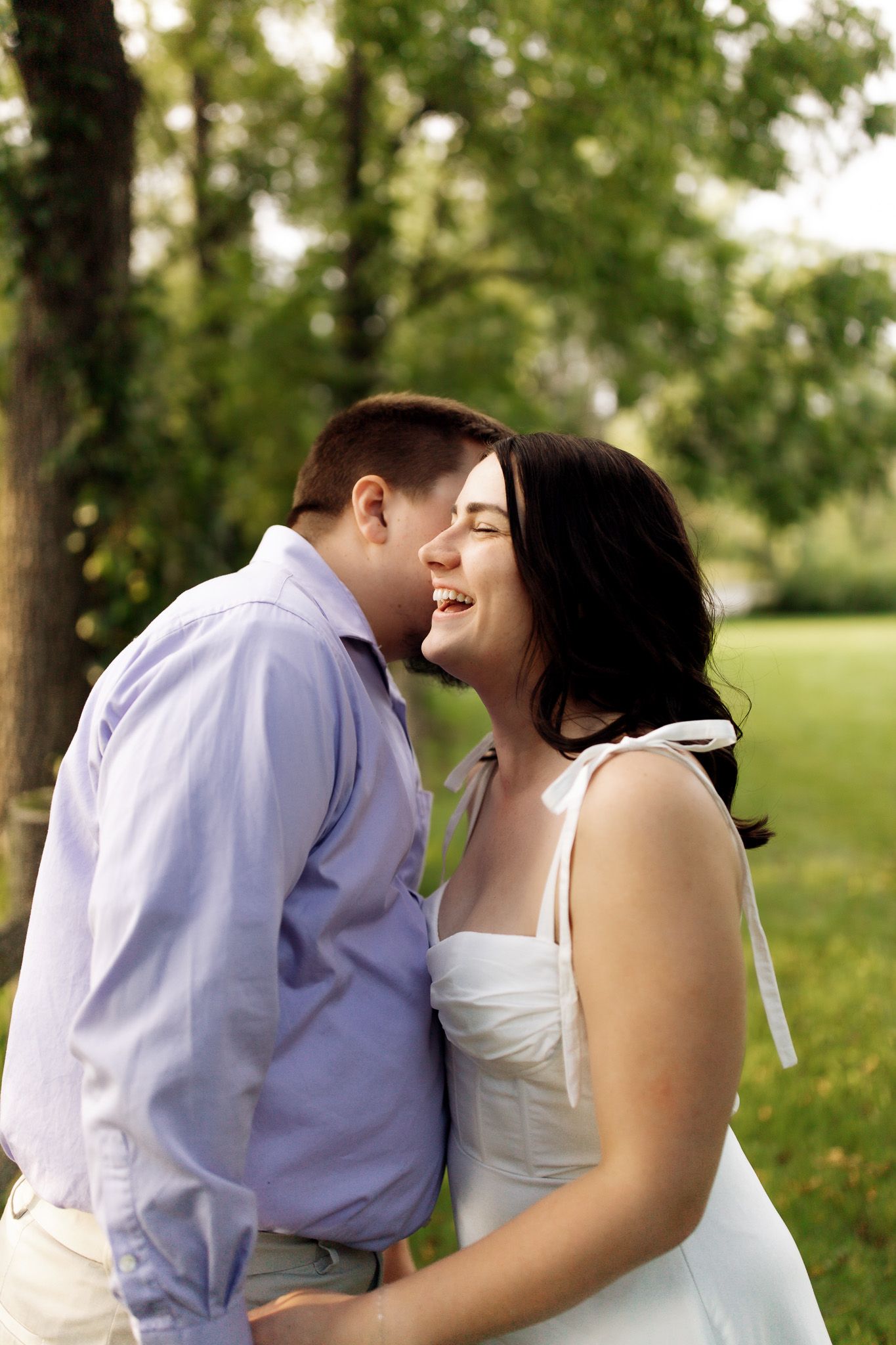 Engagement photography of a couple laughing and enjoying their session, photographed by Jessica Rose Photography, Janesville WI.