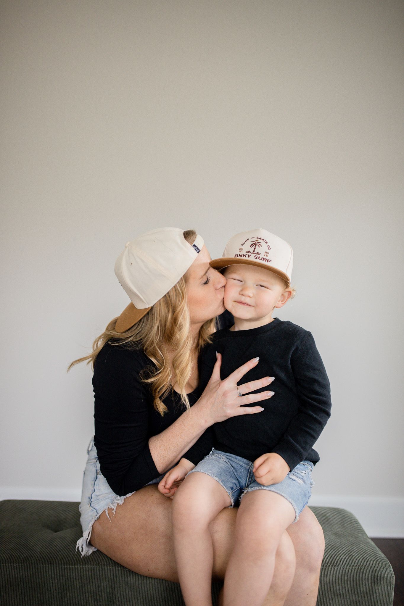 Studio family photography of mother and son sitting together, photographed by Jessica Rose Photography, Janesville WI.