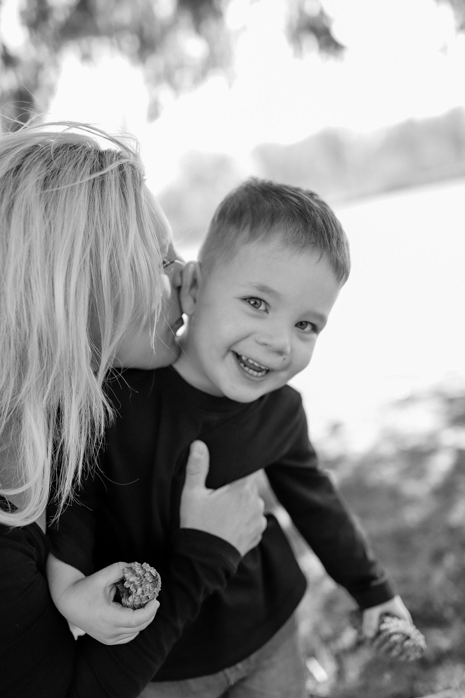 Outdoor family photography of mother and young son playing together, photographed by Jessica Rose Photography, Janesville WI.