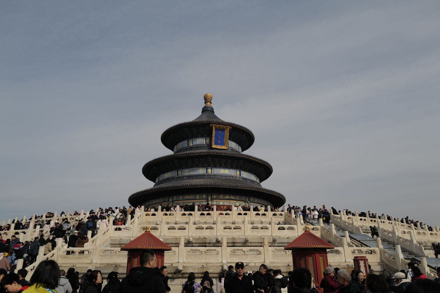Temple of Heaven's circular Hall of Prayer for Good Harvests against a cloudy sky in Beijing.