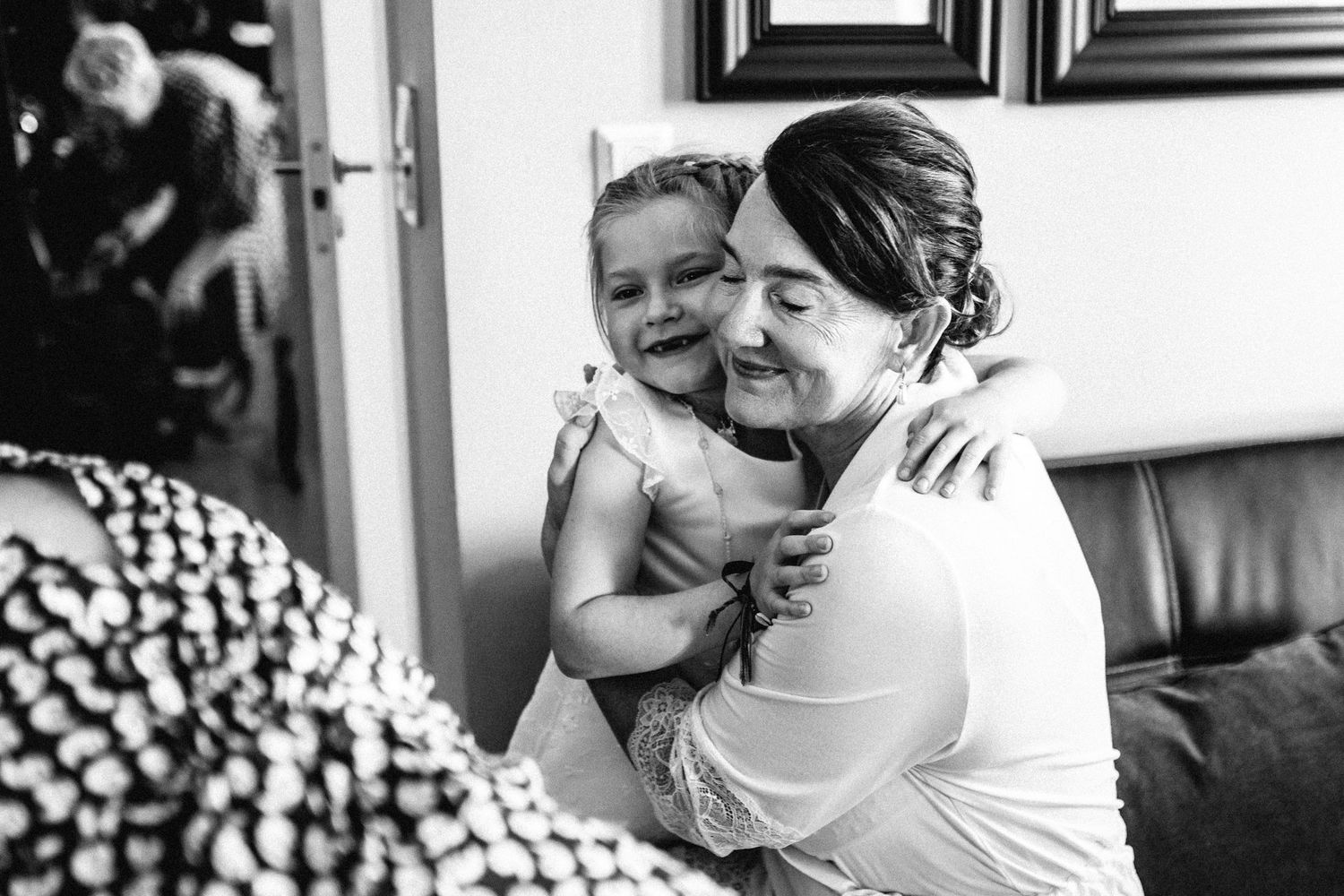 Black and white candid moment captured during a special occasion.