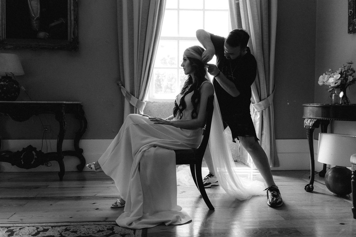 Dynamic black and white sequence showing movement in an elegant room.