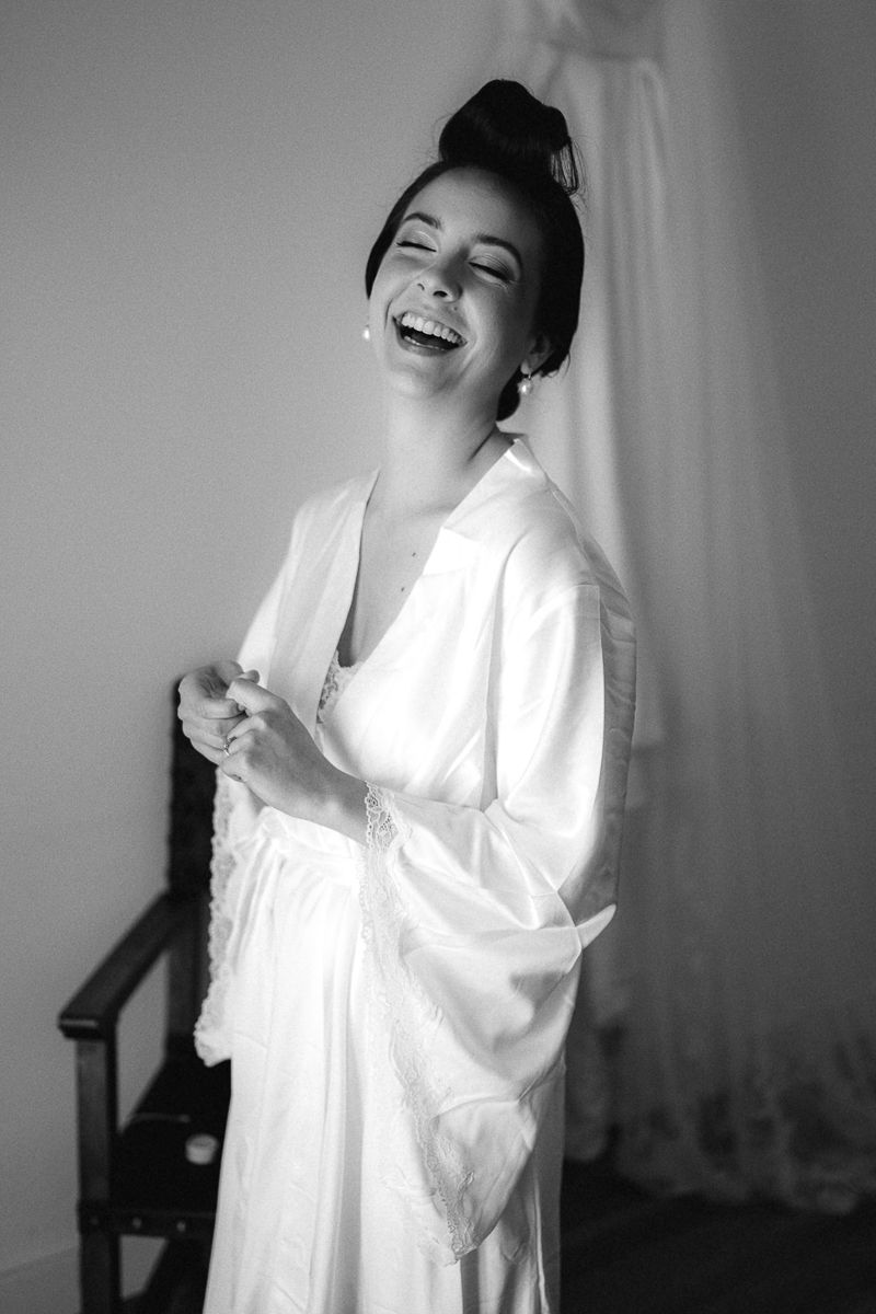 Black and white portraits showing joyful moments in a white dress.