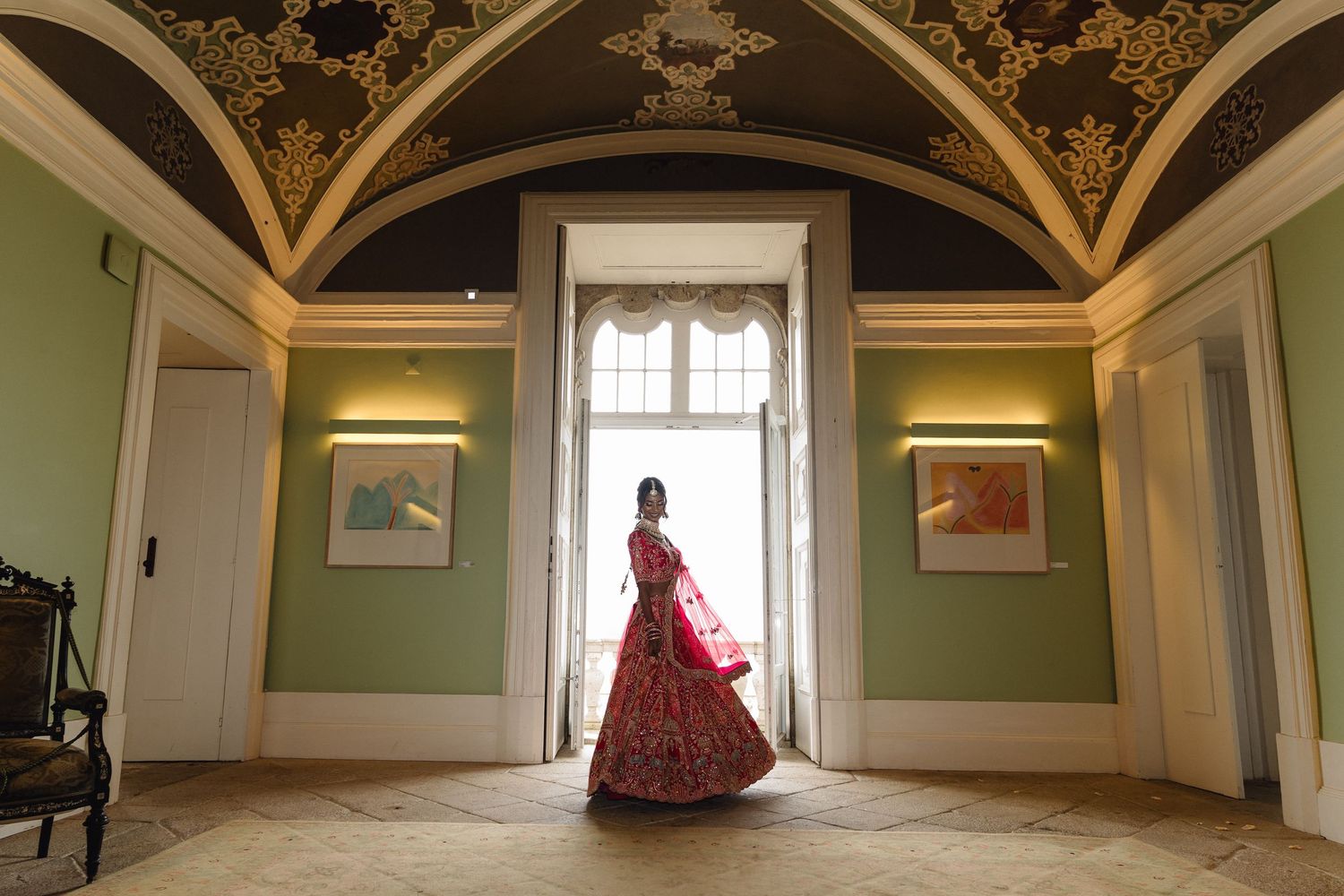 Elegant interior room with arched ceilings and ornate architectural details.
