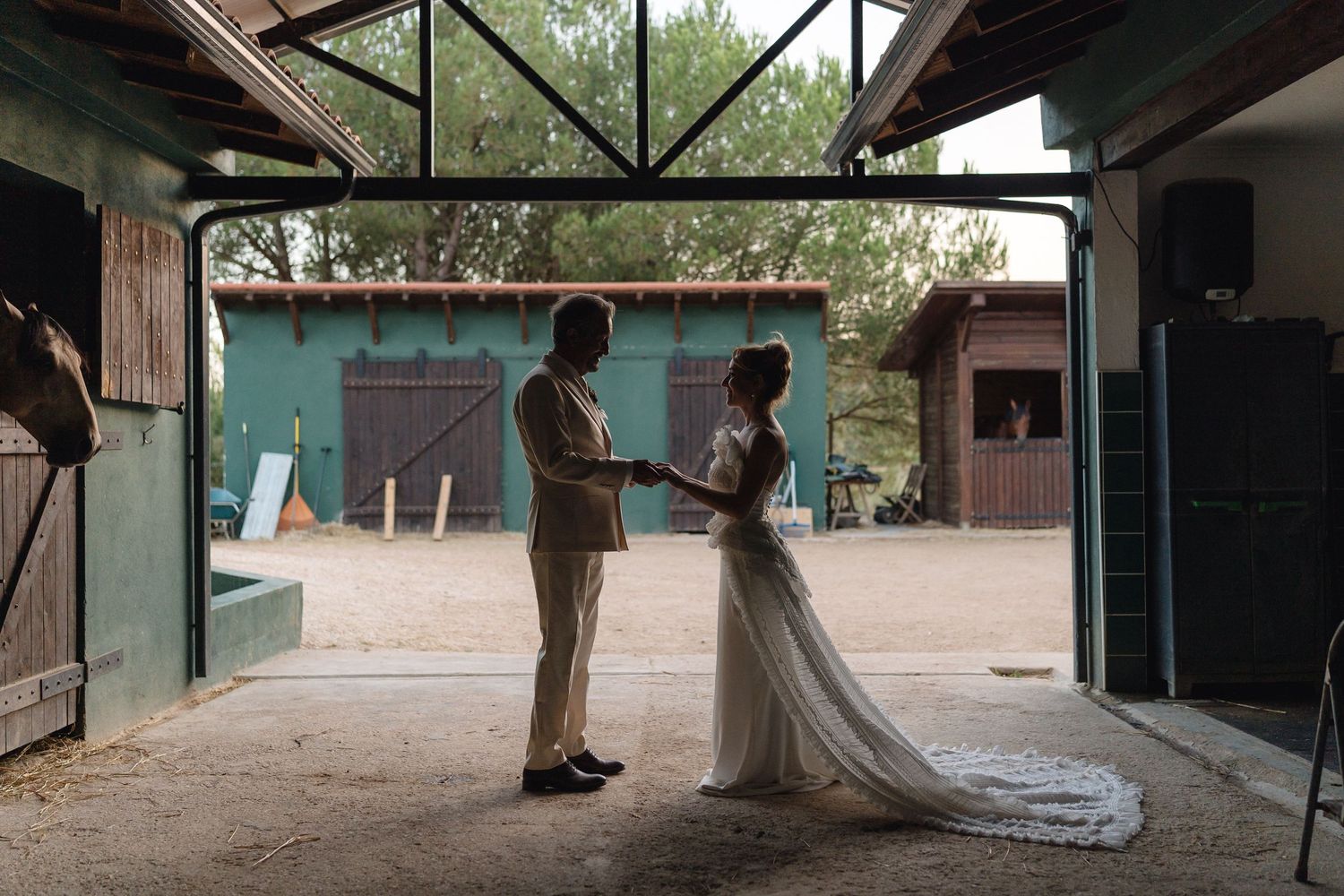 Wedding couple shares a romantic dance sequence outdoors, with the bride's white dress flowing elegantly.