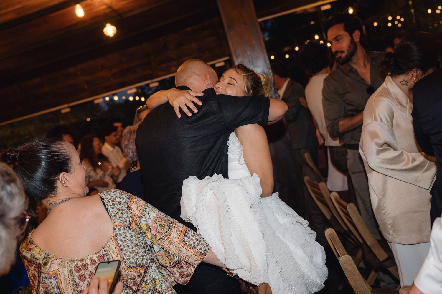 Wedding reception dance floor filled with guests enjoying the celebration.