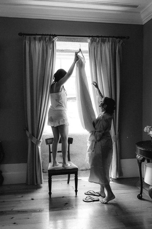 Artistic black and white sequence showing movement near a sunlit window.