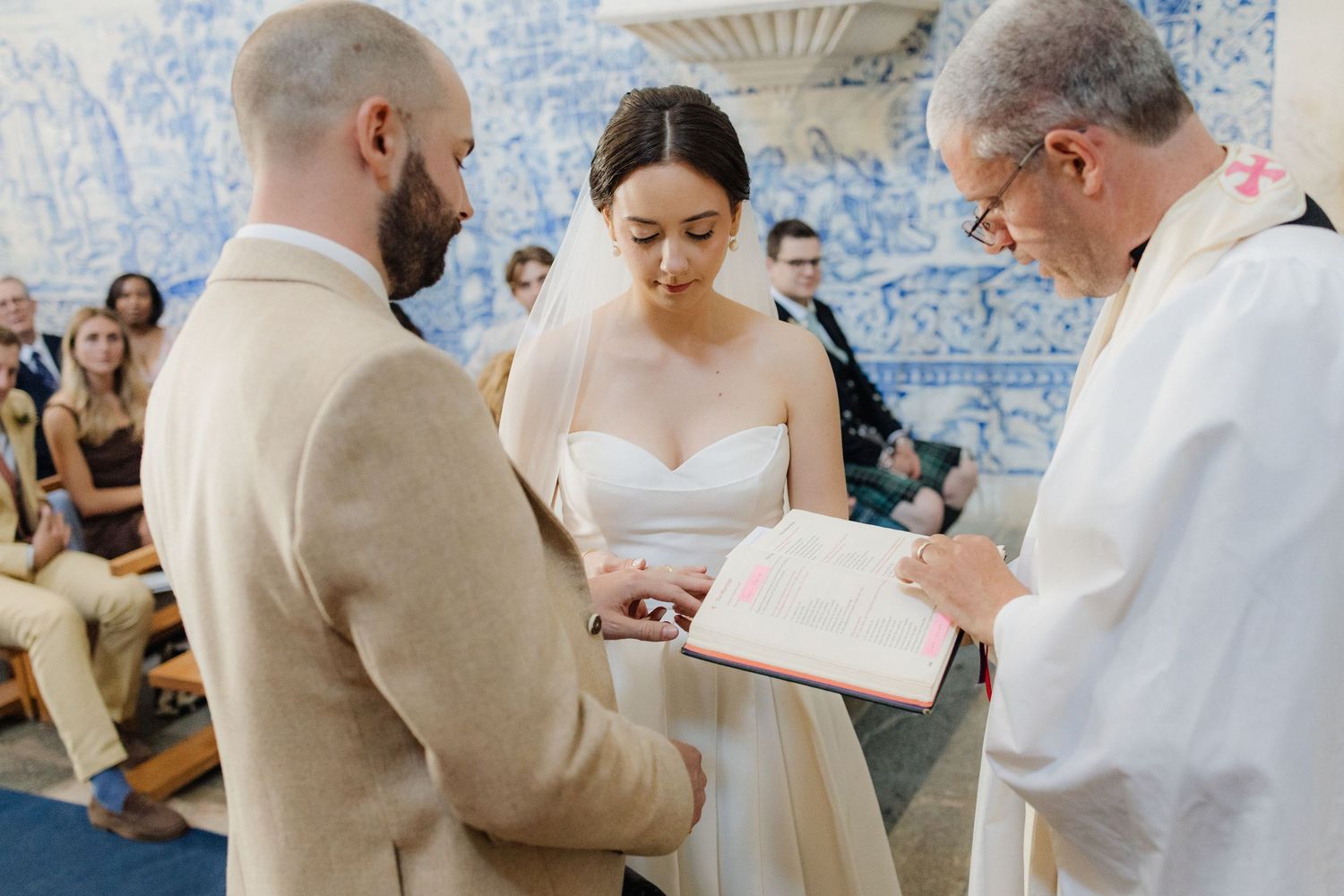 Traditional wedding ceremony proceedings in a blue-tiled Portuguese chapel.