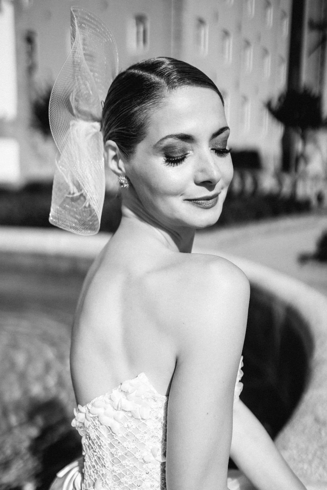 Black and white artistic bridal portrait with romantic styling.